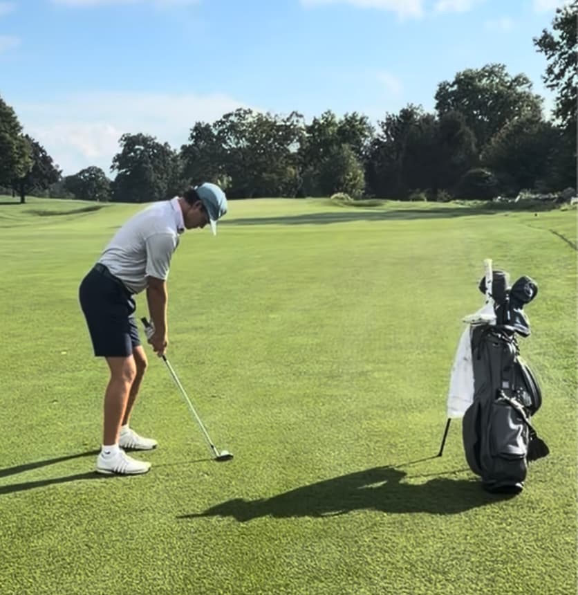 Harry Macon preparing to play an on-course approach shot
